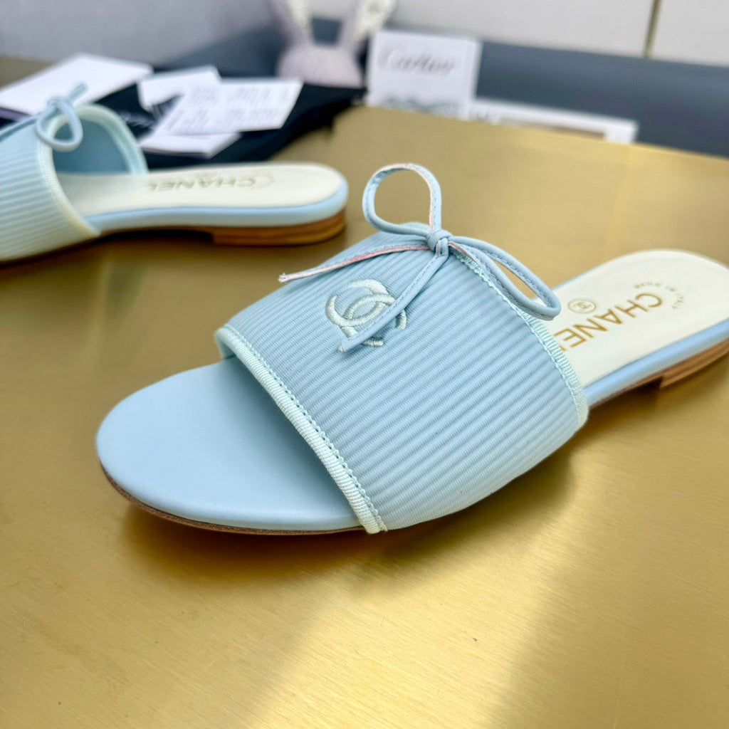 CHANEL BOW SLIPPERS IN LIGHT BLUE LAMBSKIN