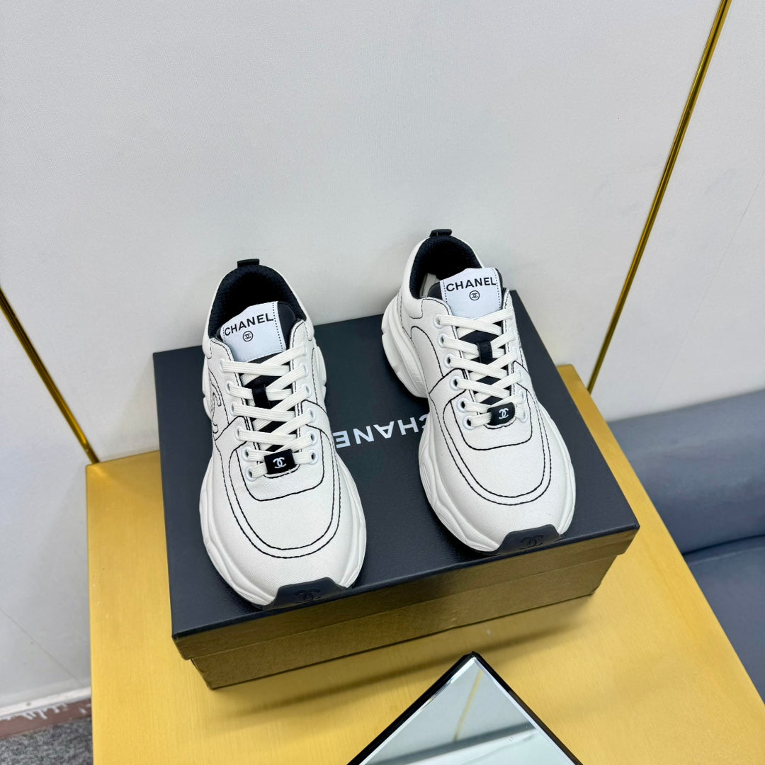 CHANEL SNEAKER IN WHITE MIX BLACK BREATHABLE FABRIC