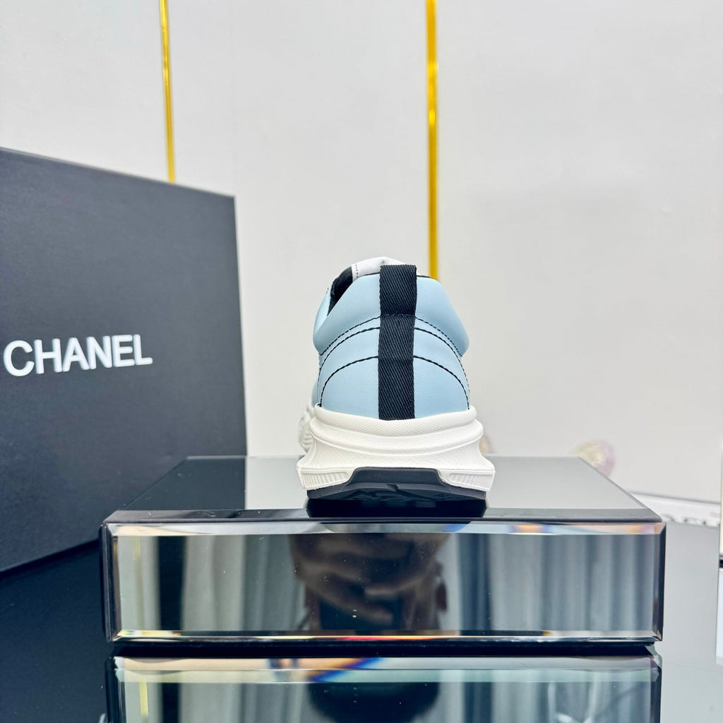 CHANEL TRAINERS SNEAKER IN LIGHT BLUE CALFSKIN WITH BLACK EMBROIDERED