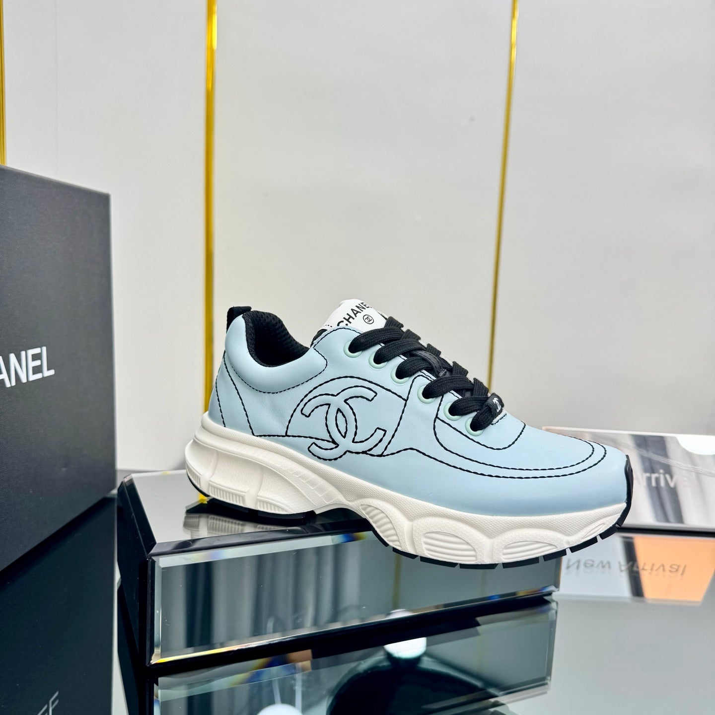 CHANEL TRAINERS SNEAKER IN LIGHT BLUE CALFSKIN WITH BLACK EMBROIDERED