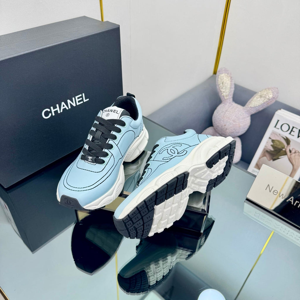 CHANEL TRAINERS SNEAKER IN LIGHT BLUE CALFSKIN WITH BLACK EMBROIDERED