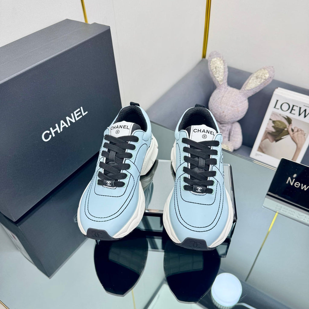 CHANEL TRAINERS SNEAKER IN LIGHT BLUE CALFSKIN WITH BLACK EMBROIDERED