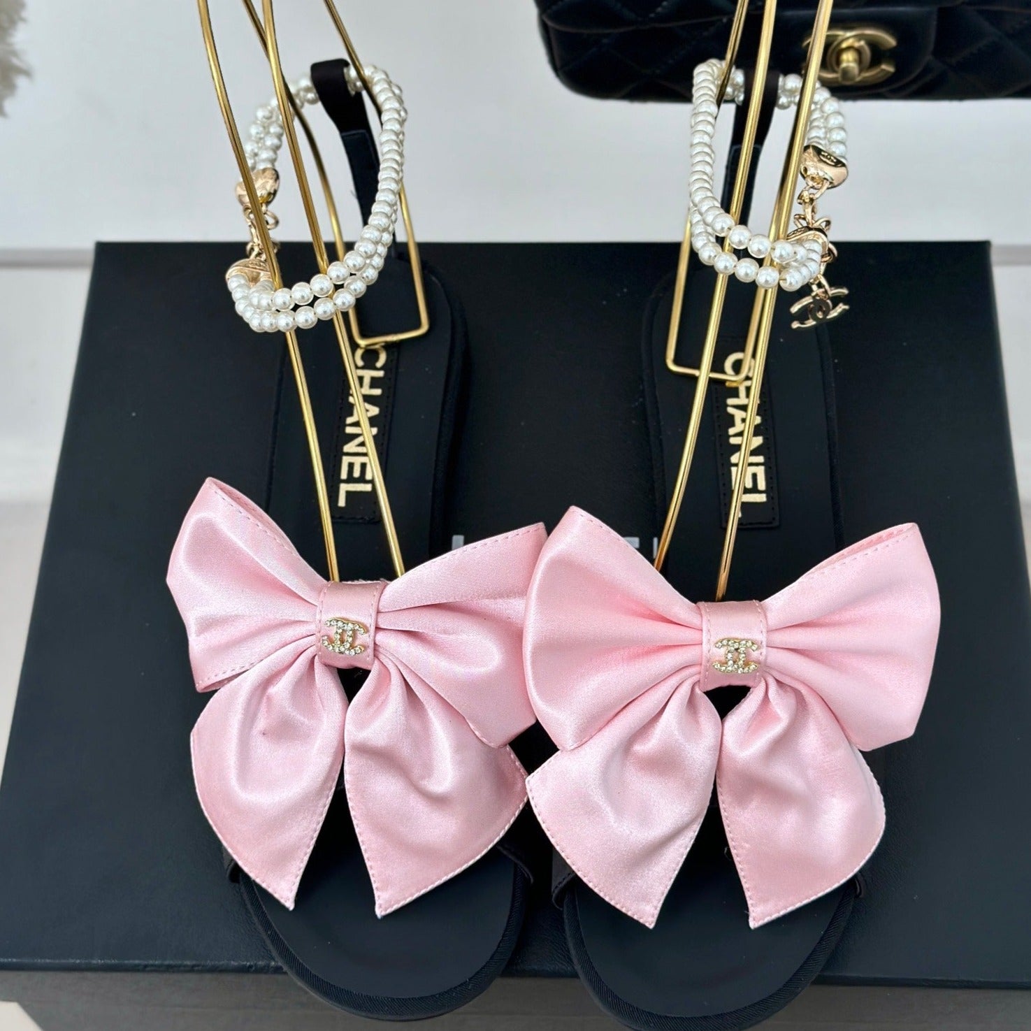 CHANEL Double C Big Bow Pearl Chain Sandals Light Pink Black Lambskin