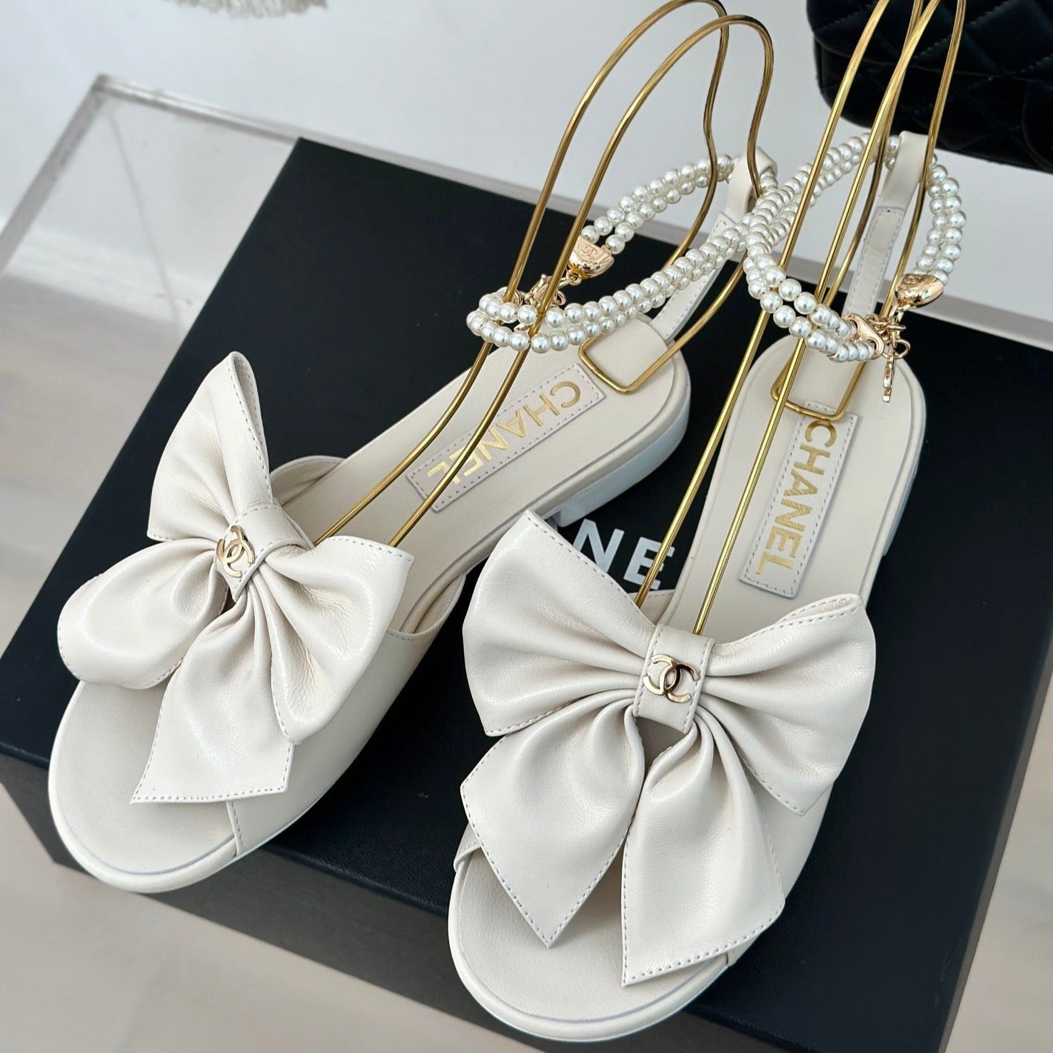 CHANEL Double C Big Bow Pearl Chain Sandals White Lambskin