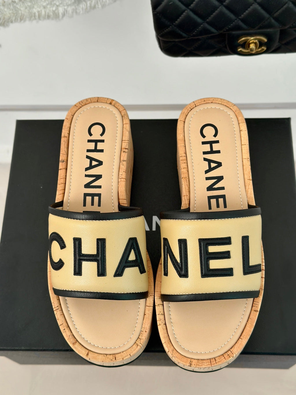 CHANEL THICK SOLE LETTER SLIPPERS IN DARK CREAM SHEEPSKIN