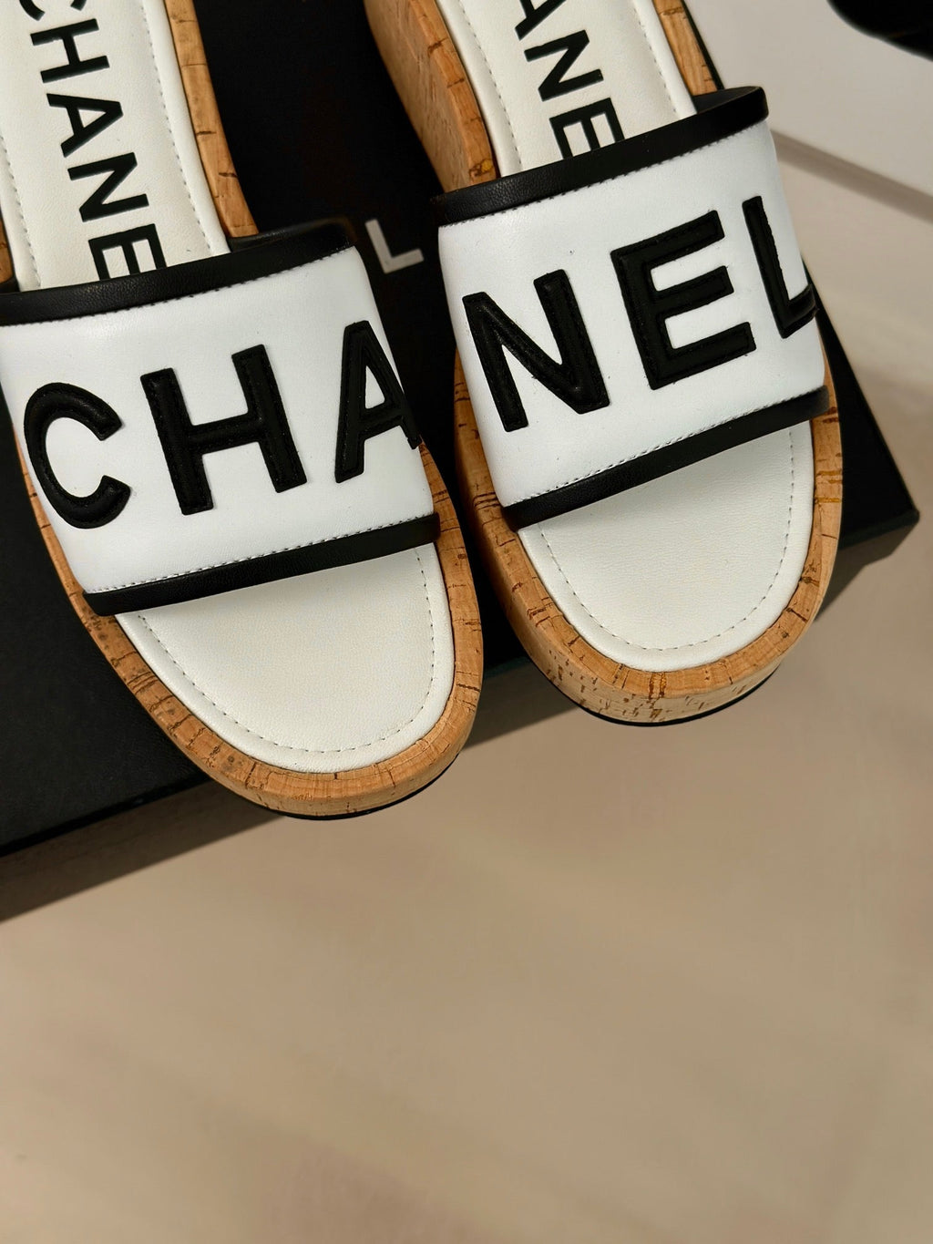 CHANEL THICK SOLE LETTER SLIPPERS IN WHITE SHEEPSKIN