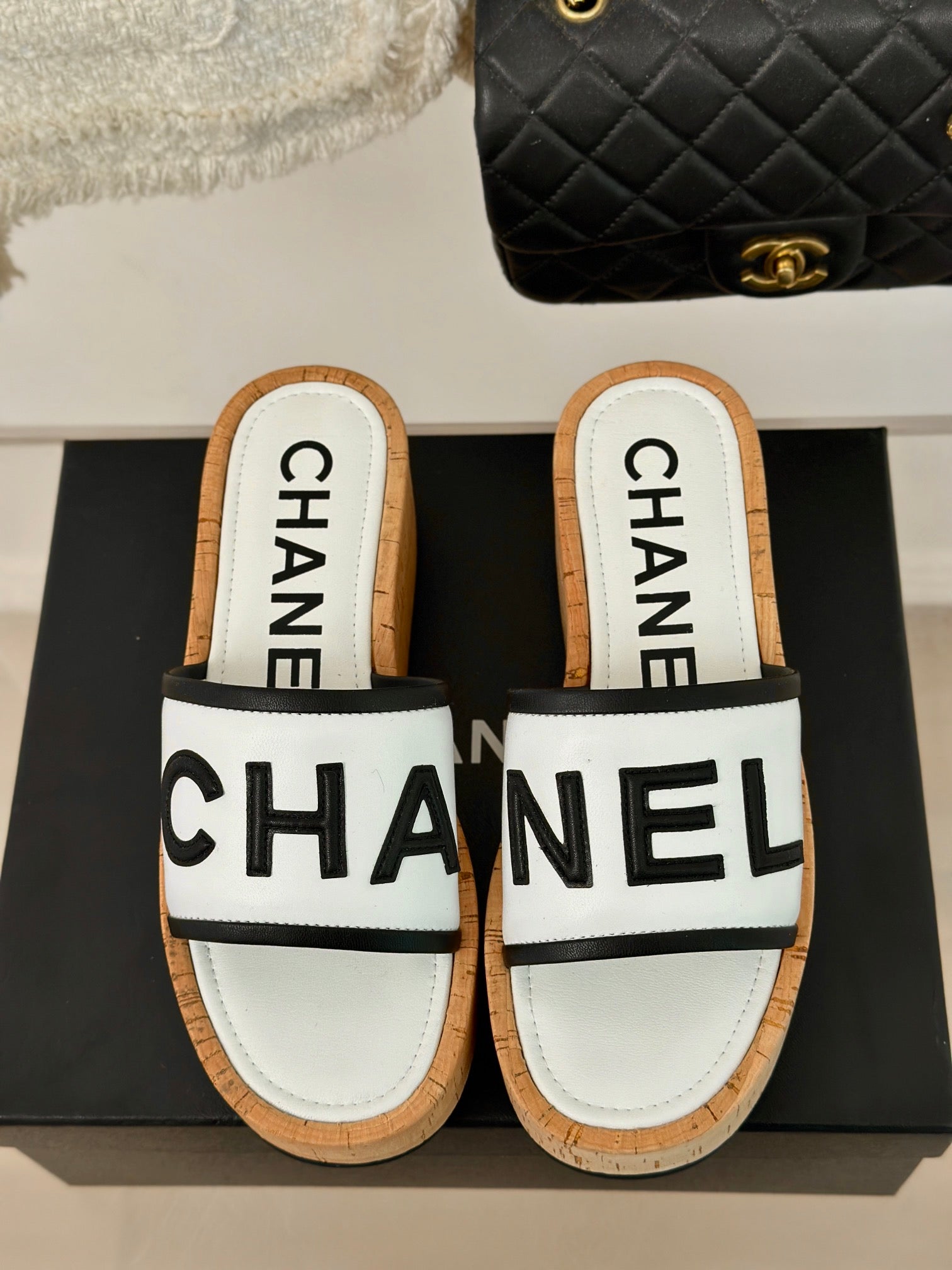 CHANEL THICK SOLE LETTER SLIPPERS IN WHITE SHEEPSKIN