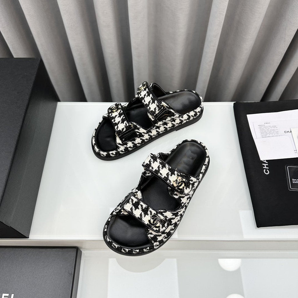 CHANEL dad sandals black white mules