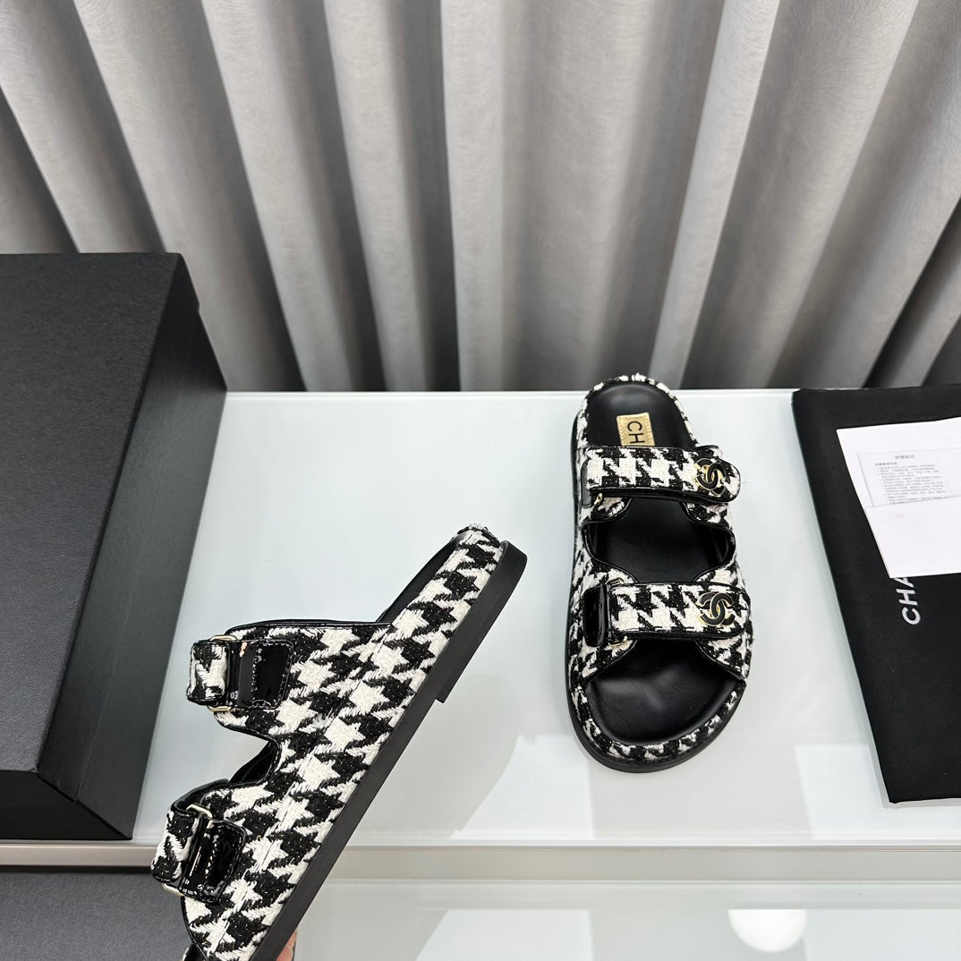CHANEL dad sandals black white mules
