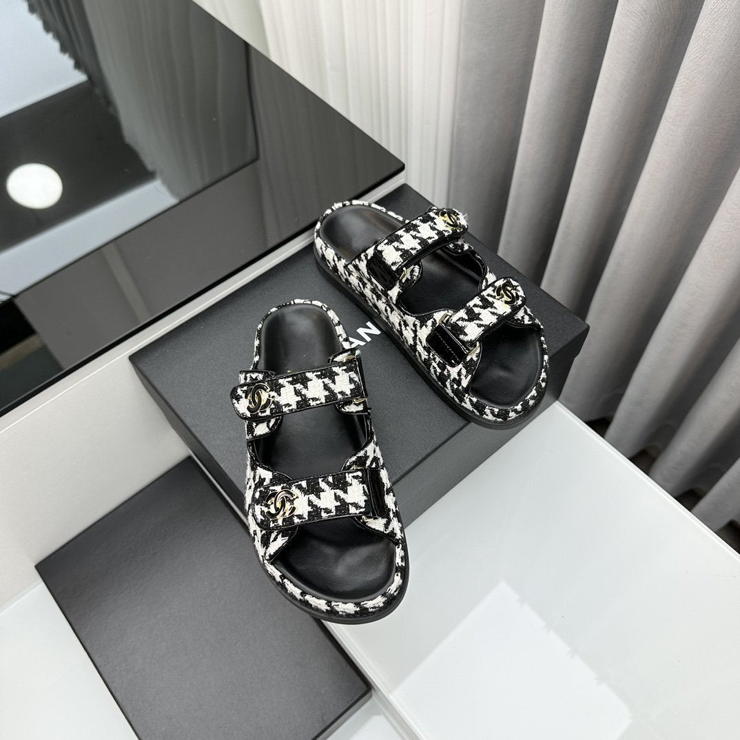 CHANEL dad sandals black white mules