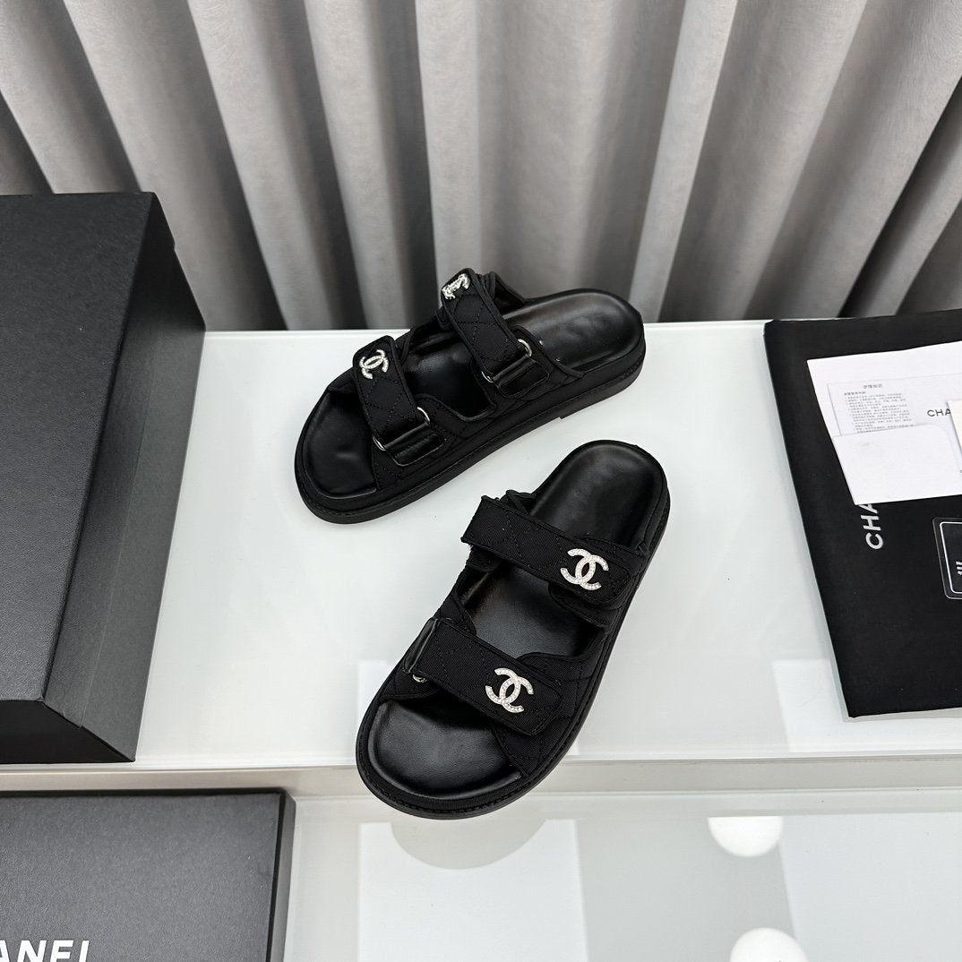 CHANEL dad sandals black textile mules