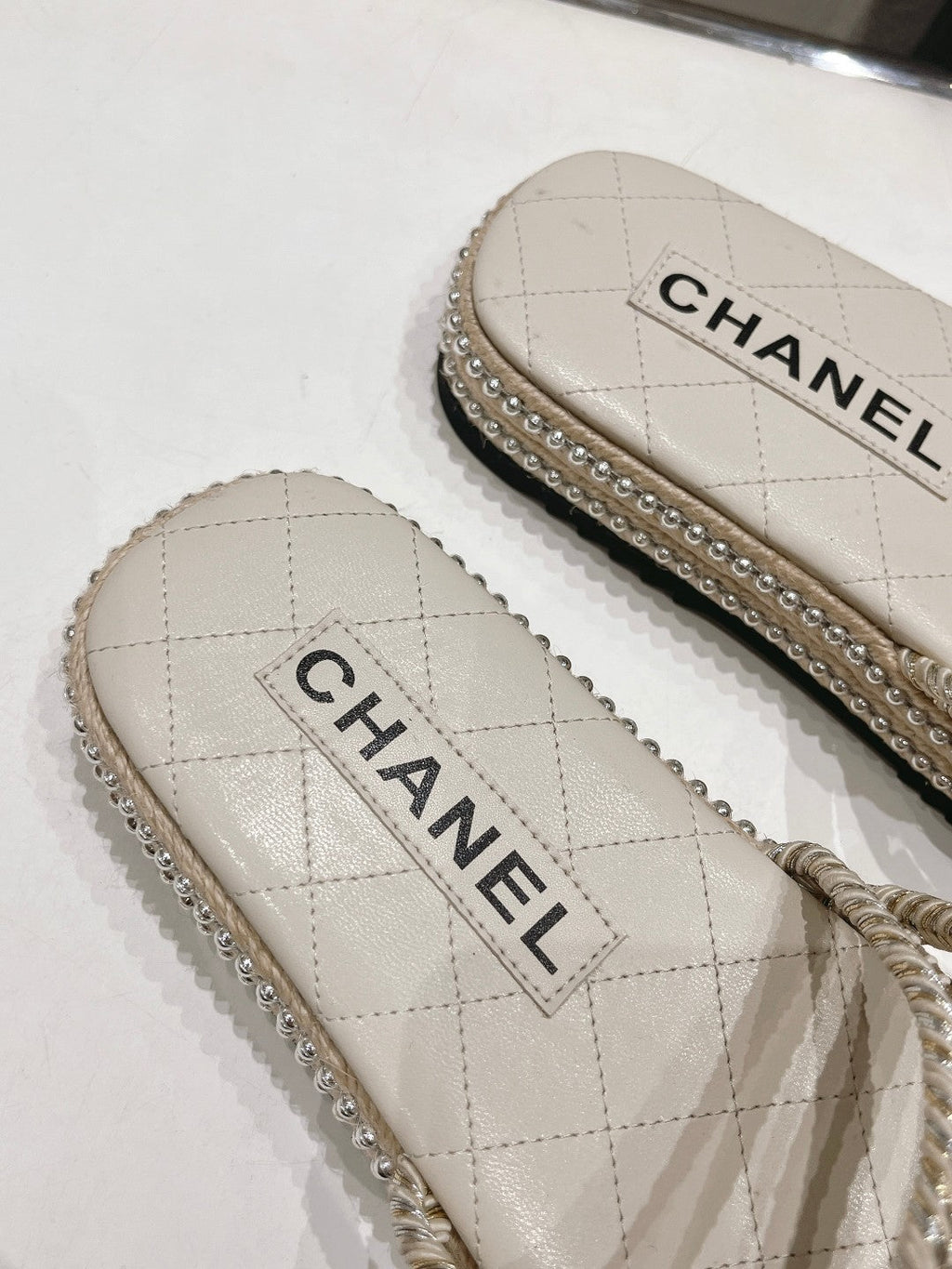 CHANEL WOVEN STRAP SLIPPERS IN WHITE LAMBSKIN