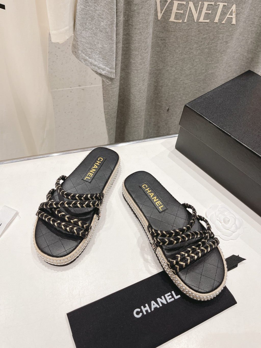 CHANEL WOVEN STRAP SLIPPERS IN BLACK LAMBSKIN