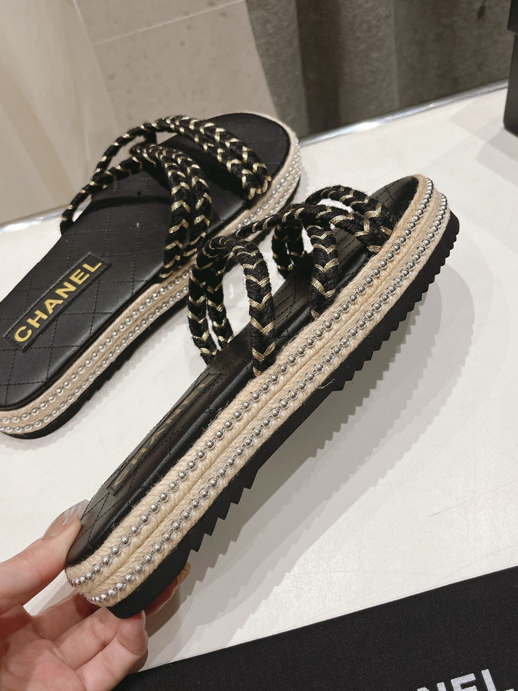 CHANEL WOVEN STRAP SLIPPERS IN BLACK LAMBSKIN