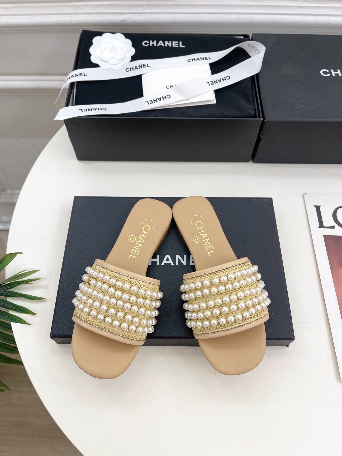 CHANEL FLAT SLIDE IN FLAX YELLOW CALFSKIN WITH PEARLS