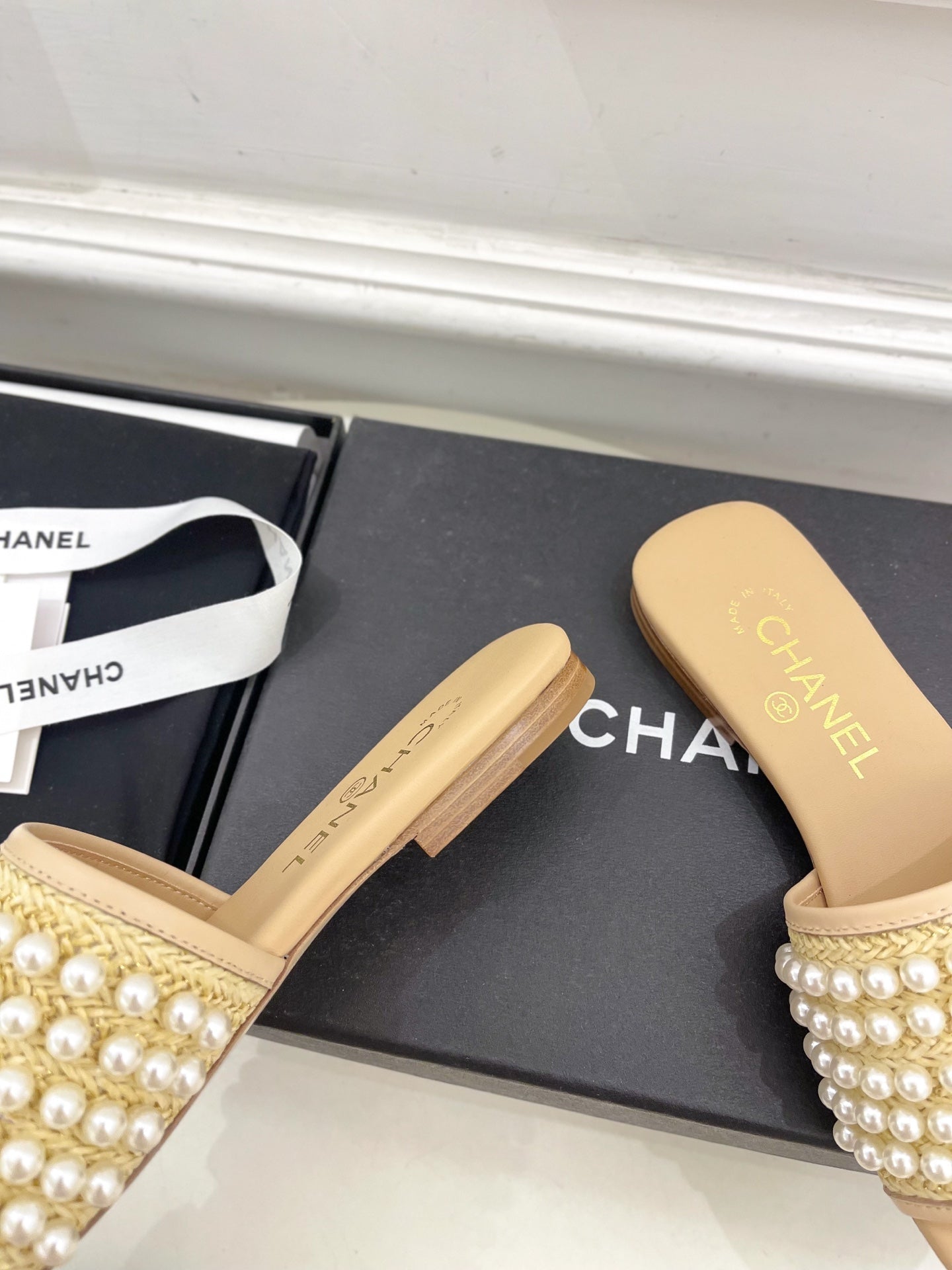 CHANEL FLAT SLIDE IN FLAX YELLOW CALFSKIN WITH PEARLS